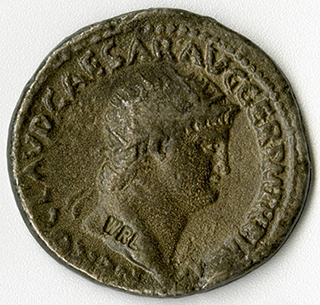 Roman coin with head of Nero. Latin inscription says NERO CAESAR AUGUSTUS