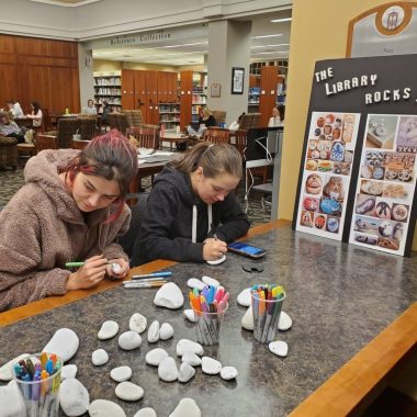 Images of students painting rocks and holding their painted rocks during an exam study break,